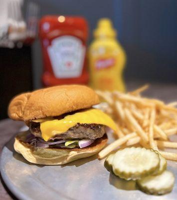 Burger w/ american cheese, lettuce, onions, lawry's mayo, potato bun | $14 + $4 fries