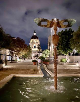 A fountain that comes from hotel and right up to across the street from city hall.