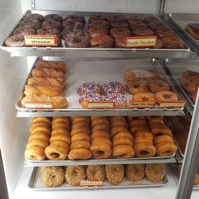 Chocolate Glazed and Chocolate Covered,  Cinnamon Twists,  Choc-covered w/ Sprinkles, Plain Fry Cakes, and Nutty Donuts