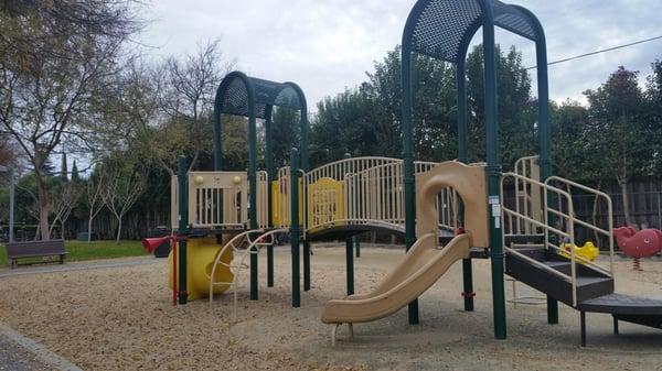 Great playground structures! Not fully fenced in, but far from the road. And the park has bathrooms and picnic tables