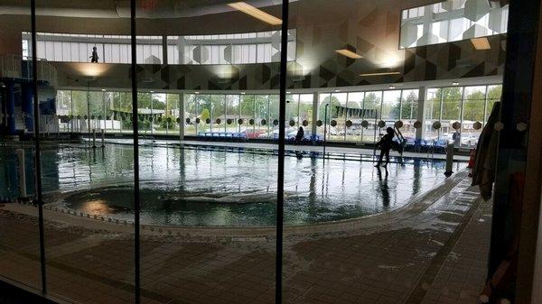 View of Indoor Aquatic Center through 1st Floor Glass Wall