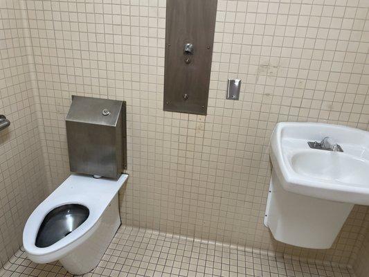 Hallway bathroom. Medal commode