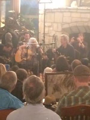 Emmylous Harris doing an impromptu show in the Yo Hotel lobby after storms canceled initial performance at festival