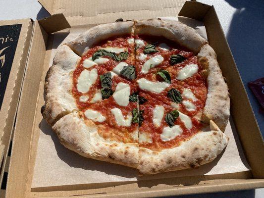 Margherita pizza with an artisan crust.