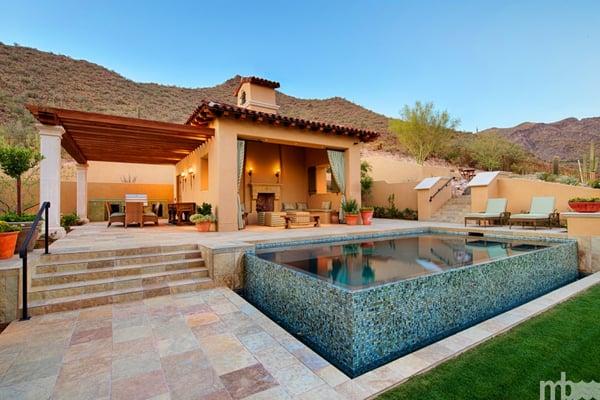 Beautiful home by award winning builder Argue Custom Homes, this pool is a beautiful tiled negative edge with cabana and glass tile.