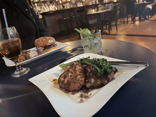 Pecan crusted chicken (front) and a Floozy burger (back). Customized mocktail (sweet/fruity) on the right.