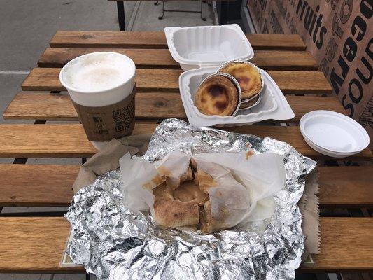 Toasted Bialy with peanut butter, Portuguese Pastel De Nara and Café au Lait