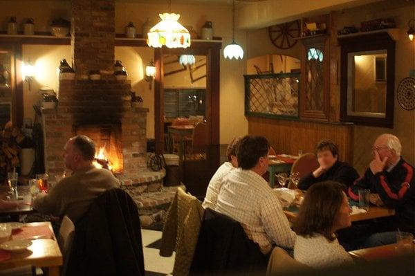 Main dining room with brick fireplace.