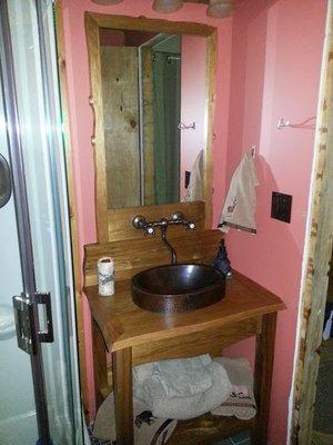 Rustic bronze hammered sink and faucet