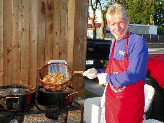 Dennis working hard at a fish fry!