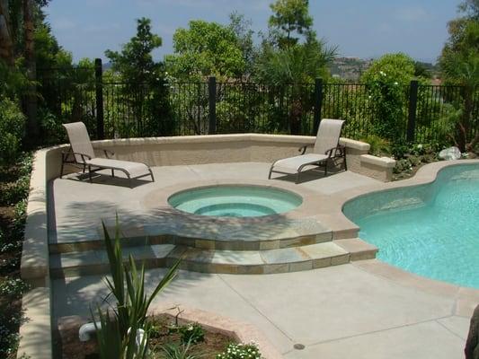 There are lots of ways to update the look of  your pool deck.  One option is to add stone as coping or as an accent on stairs.