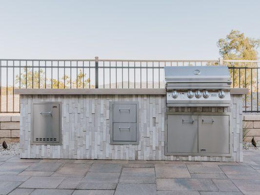 Custom BBQ island with stacked stone laid vertically