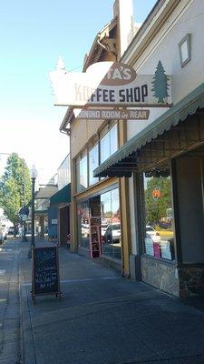 Store front next to a flower store and some great antique  shops.