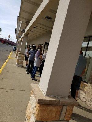 Line out the door though most got online in line.  Been here for 3 hours.  ONLY 3 OF 8 SERVICE OPEN!! WTH!?