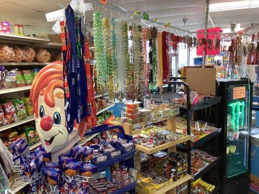 Candy and Snacks- Colorful Rosary's hanging in background.