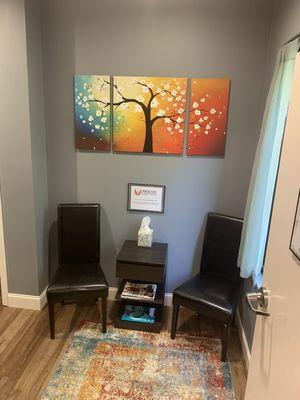 Small but cozy waiting area.  We ask our new clients to arrive 5-10mins early to fill out a basic intake form.