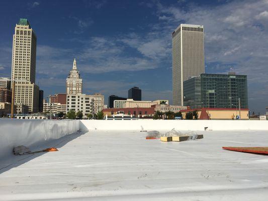 Remove 3-ply roof down to the B-deck and upgrade to tapered ISO w/ TPO roofing system.      -downtown Tulsa, OK.