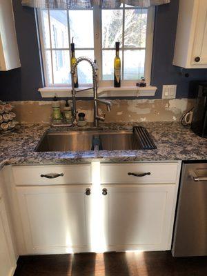 Kitchen sink install and countertops.