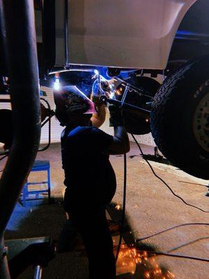 Crew member Noah stacking some phat dimes on my mangled frame rails