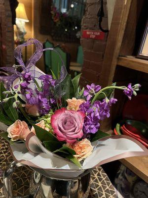 Arrangement in a water pitcher from the cook. Engagement ring on the top left.