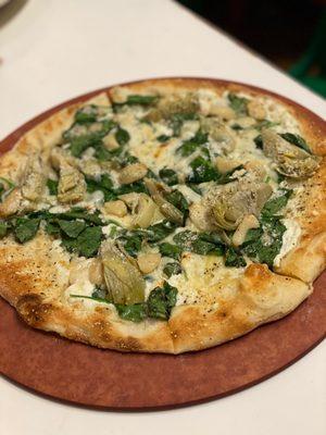 White pizza with spinach and artichoke