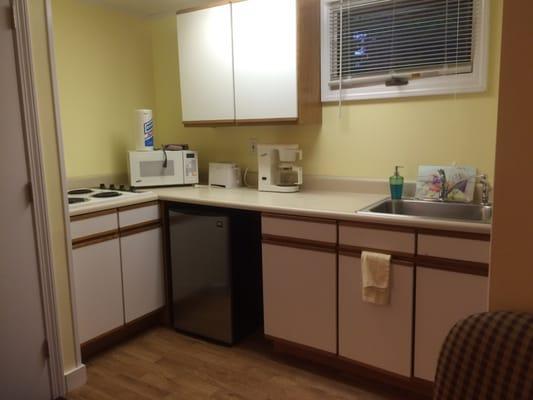 Kitchen, fridge, stove, coffee, microwave, sink