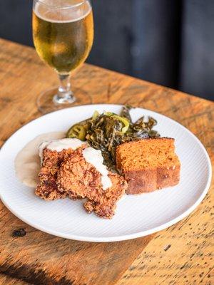 Buttermilk Fried Chicken with sweet potato cornbread, collards, honey-thyme gravy, bread & butter pickles