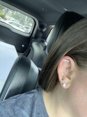 Flat helix piercing by Daryl with gorgeous curved gem jewelry