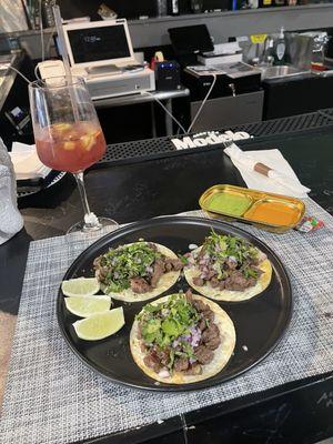 Steak tacos and red sangria.   Delicious!!!  Great service, food, ambience.