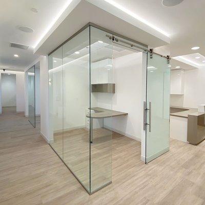 Office glass walls and sliding barn door installation.