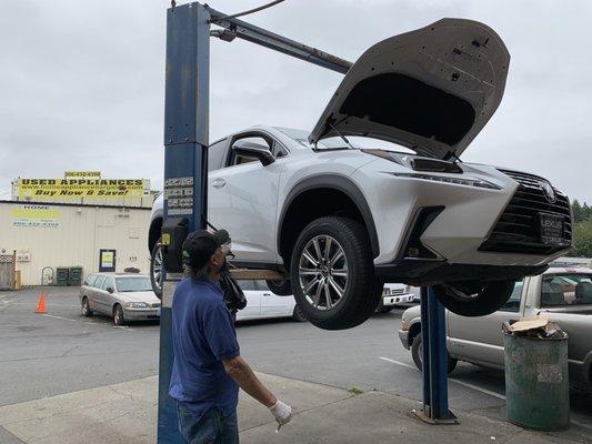 Doc inspecting the used vehicle before we purchased it