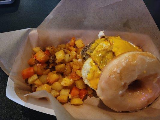 Breakfast sandwich on a Donut and amazing potatoes