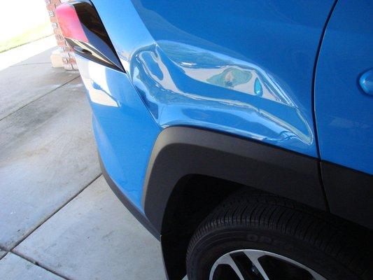 Dent on rear quarter panel of RAV 4 ffrom daughter's side view mirror.