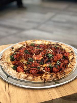 "The Lodge" large pizza. Pepperoni, cherry tomatoes, basil and balsamic vinaigrette