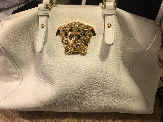 Just got my Versace handbag back after a cleaning and a replacement bolt. It looks amazing!!!!