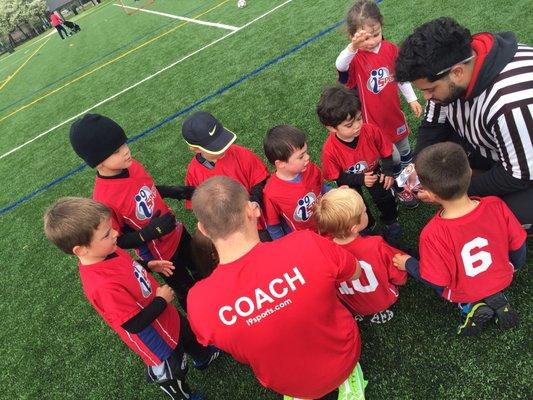 Stickers and medal distribution. Building confidence and love for the game.