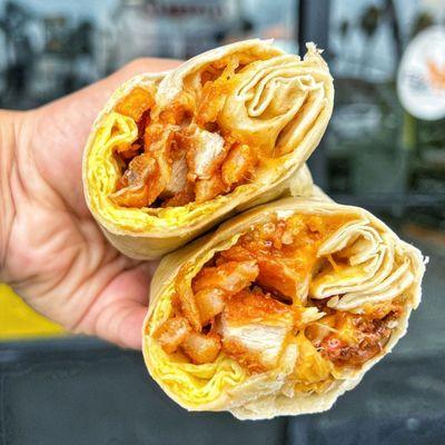 ENB Burrito made with chopped Fried Chicken, Scrambled Eggs, Fries, and Crack Sauce wrapped in a Cheese Crusted Tortilla.