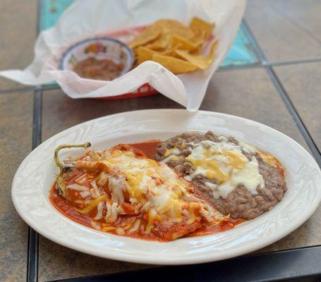 Relleno smothered in red, side of refried beans.  It's chile season. Gotta eat chile.