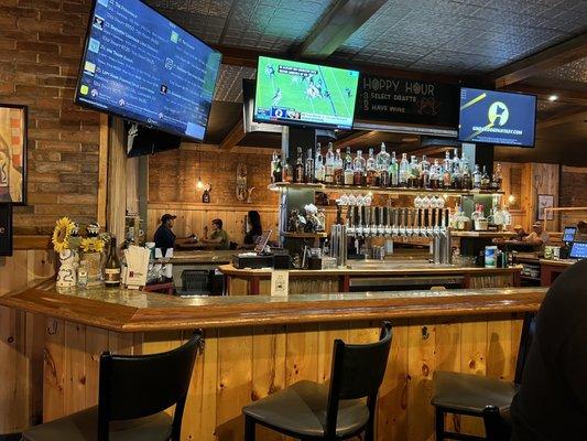 Bar with beer tap and spirits.