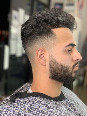 Curly hairstyle with beard line up