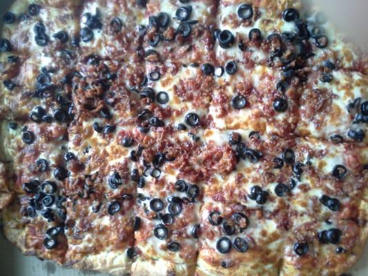 Bacon and black olive family pizza.