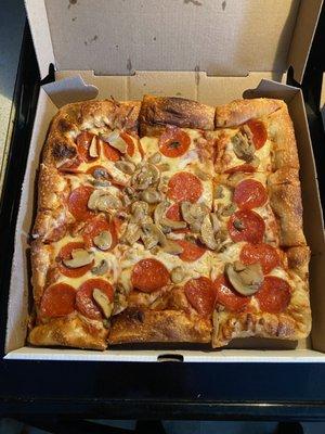 12" 12" Sicilian Square Pizza with extra cheese, pepperoni, and mushrooms.