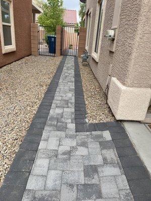 Paver pad along side house