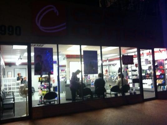 Outside of Cost Cutters at night.