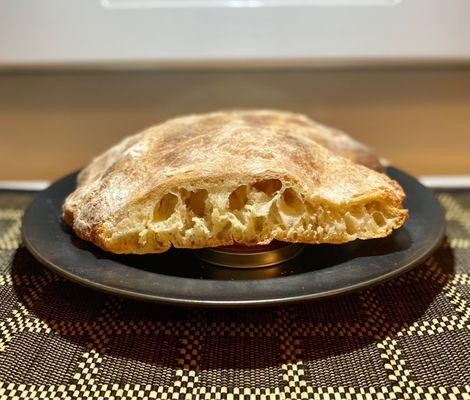 Massive ciabatta, much of which is literally hollow. Basically an Italian pita. Pretty great.