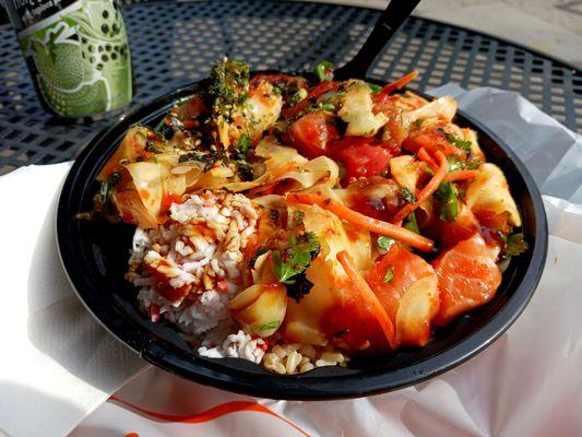 Brown Rice, salmon, tuna and albacore, sides were seaweed, carrot, cilantro and green onion. Gangnam sauce ontop.