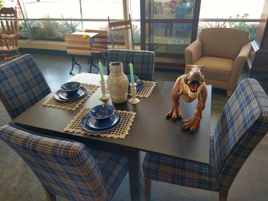 A dinosaur on a lovely dining set