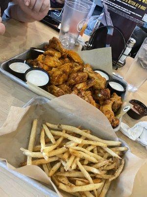 30 wings,  very crispy, spicy garlic n dry rub bbq chipotle, with a side of fries. yum