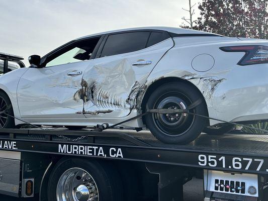 Car on the flatbed going to Rancho California auto collision