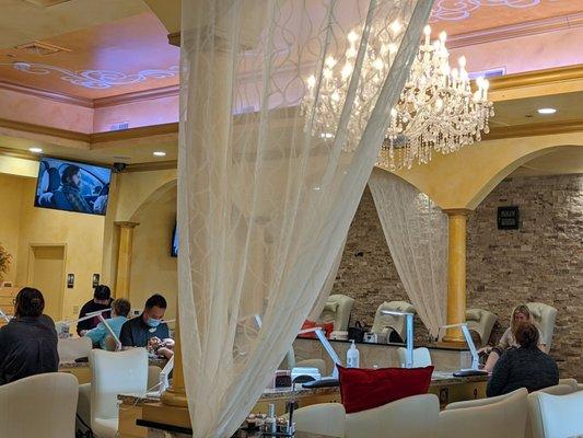 Chandelier in middle of salon